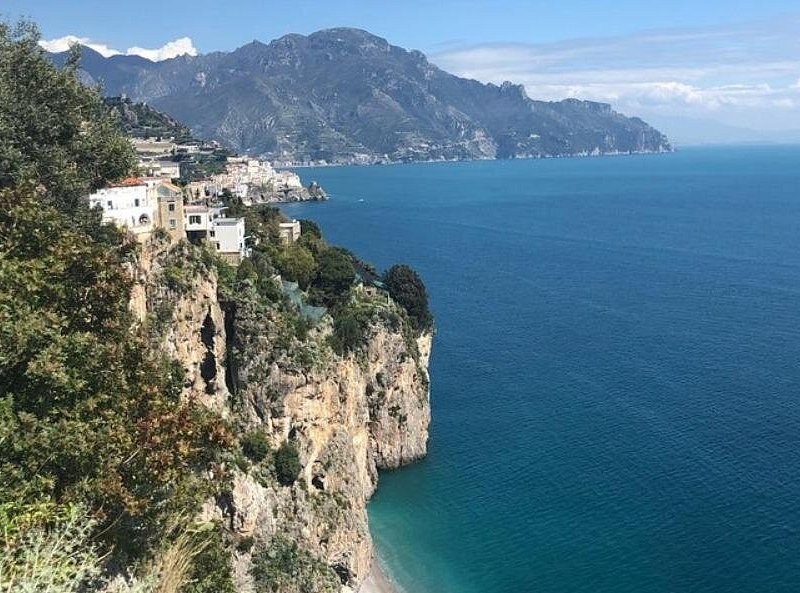 Cliffs dropping into deep blue water along the coast
