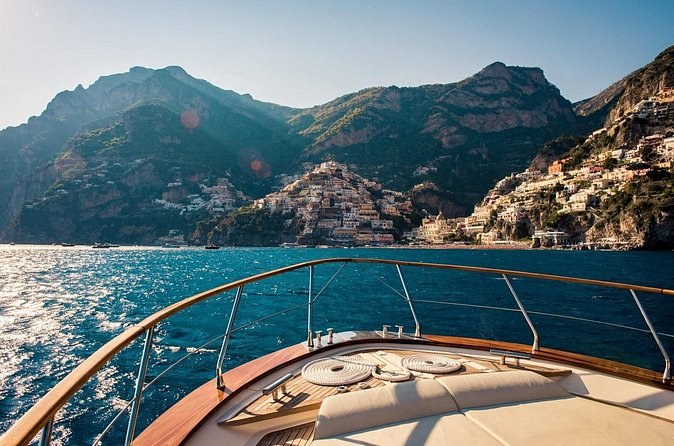 The Amalfi Coast seen over the bow of a boat heading for shore