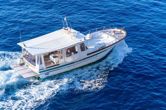 A cruise boat under way in deep blue water