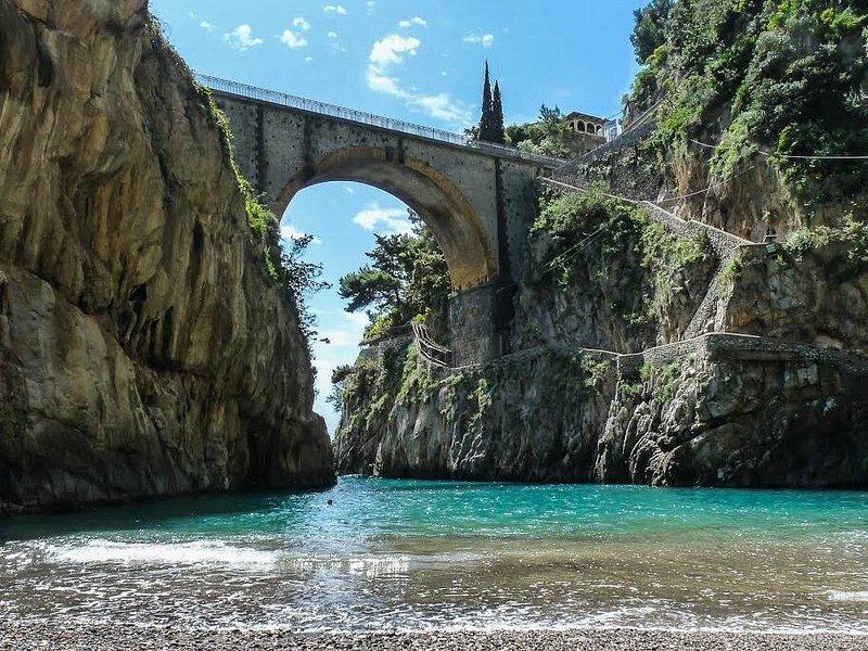 The pebble beach at the mouth of the Furore fjord, under the road bridge