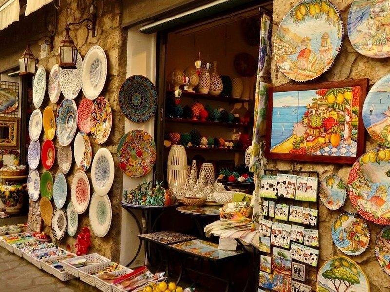Hand-painted ceramic plates on a shop wall