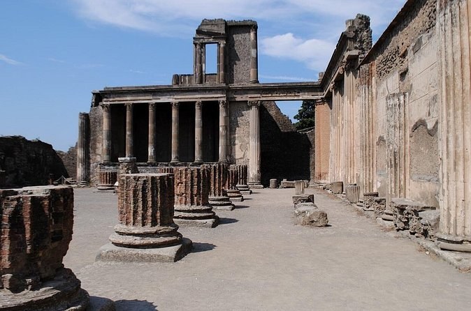 A colonnade among the ruins of Pompeii