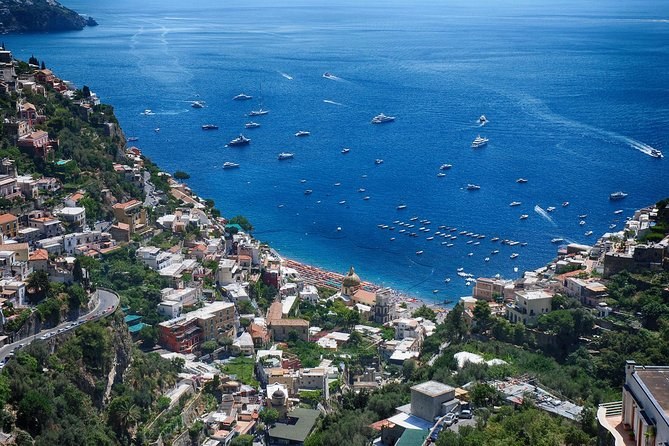 The bay below Positano from high above, boats scattered on the water