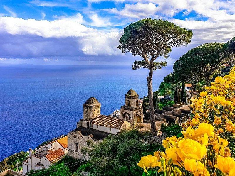 Towers and flowering gardens in Ravello, high above the sea